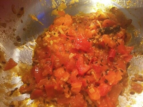 Add tomatoes to spices