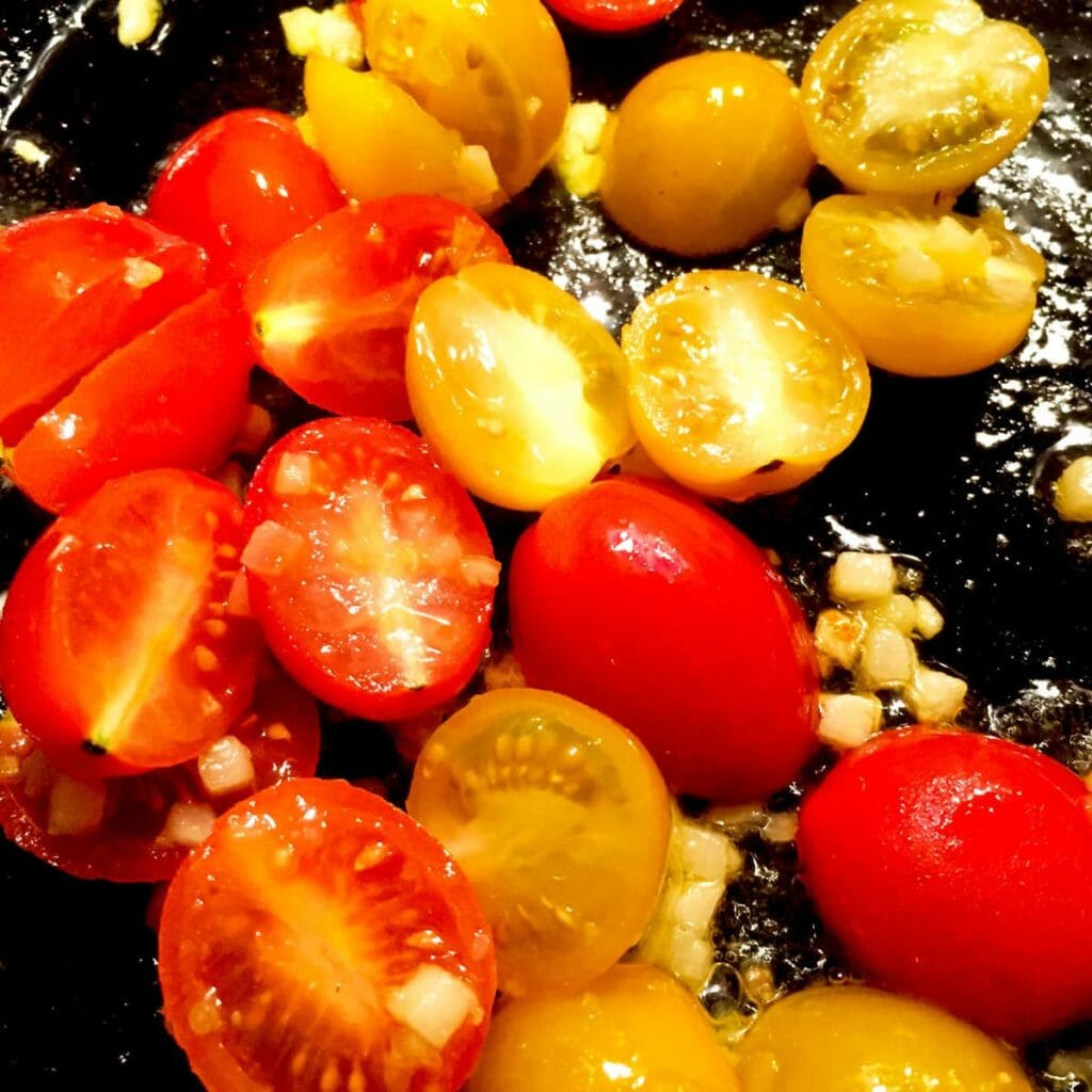 Cook tomatoes for vegetarian stuffed peppers